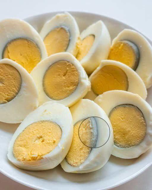 Why does a green ring appear around hard-boiled eggs?